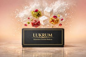 Kolorowe kostki lukru z pistacjami i pudrem w powietrzu nad czarnym pudełkiem